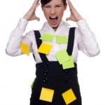 A girl with many post-it on her is Overwhelmed With Too Many Tasks