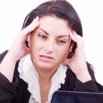 a Woman struggling in front of a laptop