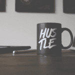 hustle written on a cup